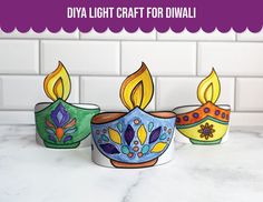 three colorful candles sitting on top of a counter next to a white tile wall with the words diya light craft for diwali