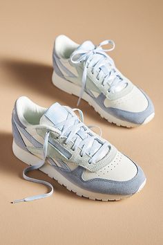 Leather upper Textile insole Rubber sole Tie styling Imported | Classic Leather Sneakers by Reebok in Blue, Women's, Size: 5, Leather/Rubber at Anthropologie Reebok Shoes For Women, Nike Womens Sneakers, Fun Sneakers For Women, Aesthetic Shoes For Women, Reebok Shoes Aesthetic, Blue Sneakers Women Outfit, Classic Sneakers Women, Cute Blue Shoes, Reebok Classic Outfit