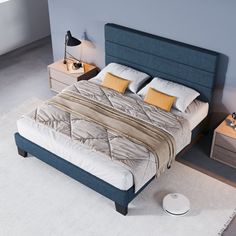 a bedroom with a bed, nightstands and two night stands on the carpeted floor