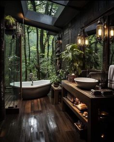 a bathroom with a tub, sink and large mirror in it's center surrounded by greenery