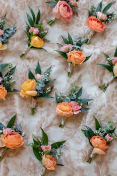 a bunch of flowers that are laying on a table