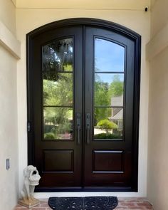 a black double door with two sidelights