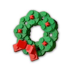 a christmas wreath made out of legos on a white background