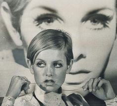 a woman holding a spoon in front of her face with the image of a man's face behind her