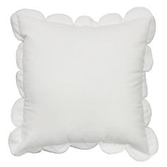 a white pillow with scalloped edges