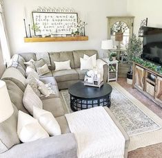 a living room filled with furniture and a flat screen tv