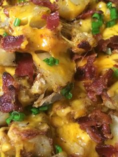 a close up view of some food with cheese and bacon on it's side