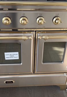 two ovens with labels on them sitting next to each other