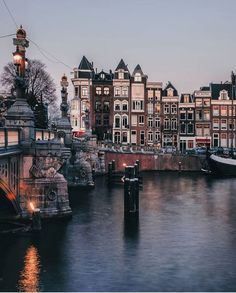 a river with some buildings and lights on it