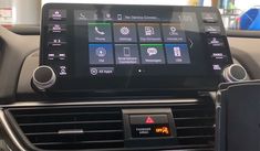 an image of a car dashboard with the radio and info panel on it's display