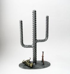 a metal candelabra with two menorah candles and an elephant figurine