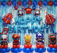 a birthday party with balloons and decorations for the boys's first birthday, including iron man masks