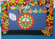 a colorful bulletin board decorated with flowers and candles