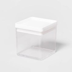 a clear plastic container with a lid on the top and bottom, sitting on a white surface