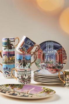 a table topped with plates and cups filled with different types of coffee cup's