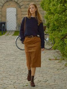 The Randers Pencil Corduroy Skirt is a versatile piece that combines classic corduroy material with a modern design. It features the semi low-rise H-line skirt made of sturdy corduroy material.- Medium length for slim body coverage- Side pockets and back pockets- Completed with contrasting detail inside the waistband for a polished look* The actual color of the product is the most similar to the product cut. Midi Suede Skirt, Tan Courderoy Skirt Outfits, Corduroy Long Skirt Outfit, Courdory Skirt Outfits Fall, Courdory Skirt Outfit Fall, Tan Skirt Outfit Fall, Courderoy Skirt Outfits Women, Everyday Skirt Outfits, Long Corduroy Skirt Outfit