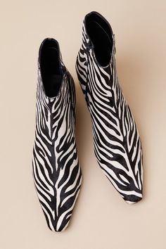 Throwback-chic meets modern perfection in the Steve Madden Delvie-A Zebra Calf Hair Pointed-Toe Ankle Boots! Sleek, genuine calf hair (with a black and white zebra print throughout) shapes these fun booties with a pointed-toe upper that rises to an ankle-high shaft. A 6.5"" zipper at the instep makes for effortless on-and-off, while a low blade heel completes the look! 2" blade heel. Lightly cushioned insole. Rubber sole has nonskid markings. Genuine leather upper and sock. Synthetic lining. Bal Ankle High Heel Boots, White Zebra, Calf Hair, Heel Boots, Zebras, High Heel Boots, Zebra Print, High Heel, Steve Madden