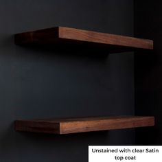 two wooden shelves against a black wall with text that reads, unstained with clear satin top coat