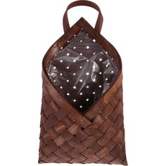 a brown bag with white polka dots on the front and back pocket, in woven leather