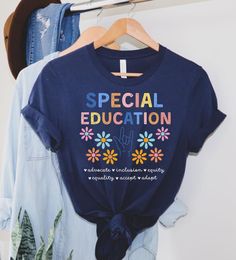 a t - shirt with the words special education on it hanging from a clothes rack