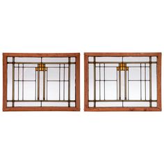 two antique stained glass windows with gold accents