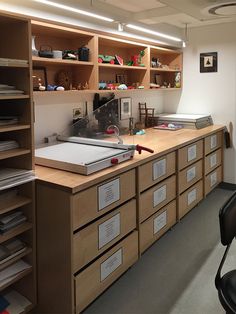 an office with lots of drawers and shelves