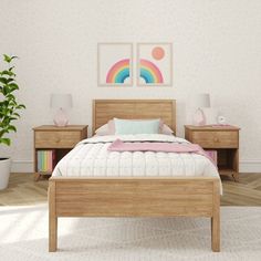 a bedroom with a bed, nightstands and potted plant in front of it