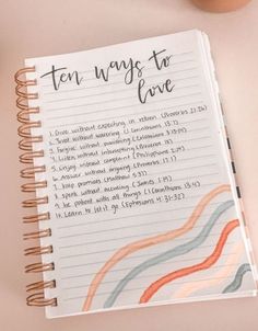 an open notebook with the words ten ways to love written in cursive writing