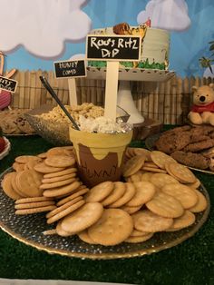 a dessert table filled with cookies and cakes