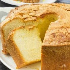 a close up of a cake on a plate with one slice cut from the cake