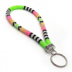 a keychain with a metal ring and colorful beads on the end of it