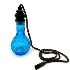 a blue glass bottle is connected to a black cord