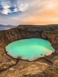 a large blue lake surrounded by mountains and water in the middle of an arid area