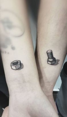 two people with matching tattoos on their arms