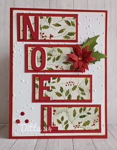 a handmade christmas card with holly and poinsettis on the front side