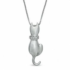 This kitty is sitting pretty! Fashioned in sleek sterling silver, this charming kitty features a satin textured finish and a collar of shimmering diamond accents. His looping tail is a clever touch. Buffed to a brilliant shine, this fanciful feline suspends along an 18.0-inch box chain that secures with a spring-ring clasp. Charming Kitty, Cat Pendant, Sitting Pretty, Cat Pendants, Box Chain, Diamond Stone, White Metal, Necklace Designs, Spring Rings