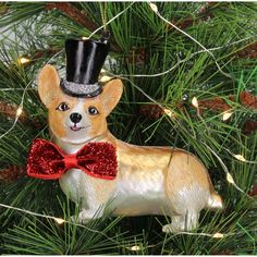 a christmas tree ornament with a dog wearing a top hat and bow tie