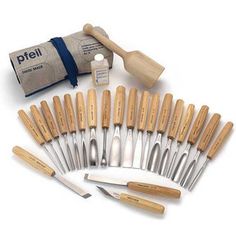 an assortment of kitchen utensils with wooden handles