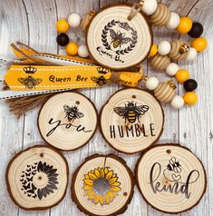 wood slice ornaments with bees and words on them