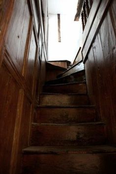 stairs leading up to the second floor in an old house