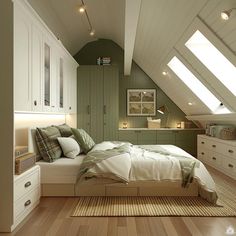 an attic bedroom with wooden floors and green walls, white bedding and storage cabinets