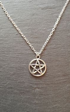 A pentagram on a silver plated chain with extender. Choose from 14-16 or 16-18 inches in length. Comes in an organza gift bag Diy Pentagram Necklace, Gothic Star-shaped Metal Necklace, Witch Necklace Pendants, Gold Pentagram Necklace, Elven Costume, Silver Pentagram Necklace, Pentagram Necklace, Pagan Witch, Silver Plated Necklace