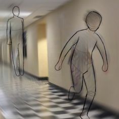 two people walking down a long hallway with black and white checkered flooring