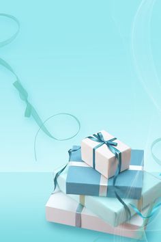 three wrapped presents are stacked on top of each other and tied with blue ribbon around them