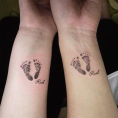 two people with matching tattoos on their arms and feet, both showing the same foot prints