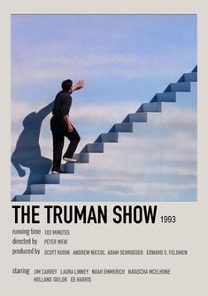 the truman show poster with an image of a man walking up stairs