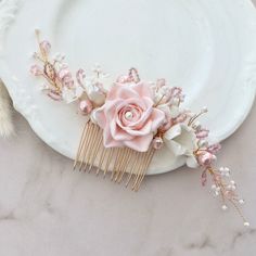 A stunning bridal hair comb which has been lovingly hand crafted , suitable for the Bride, Bridesmaids, Mother of the bride/groom or even wedding guests .  All my bridal hair accessories are made to the very highest standard using the finest quality materials whilst paying care and attention to detail.   Materials . Blush pink and white hand crafted clay flowers  . Seed beads . Pink Glass pearls . Quality pink Austrian crystals . Gold coloured wire & comb . Introductory price !! It will arrive i Pink Flower Hair, Bridal Hair Piece, Gold Hair Accessories, Flower Hair Comb, Clay Flowers, White Hand, Bridal Hair Comb, Bridal Hair Pieces, Gold Hair