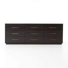 a black and gold dresser against a white wall