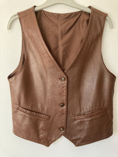 Vintage leather unisex waistcoat. Fall Leather Sleeveless Jacket, Classic Leather Vest For Workwear, Vintage Business Vest For Fall, Classic Brown Vest For Spring, Leather Vest Jacket For Fall, Leather Sleeveless Vest For Winter, Fitted Leather Vest For Fall, Sleeveless Leather Vest For Fall, Leather Sleeveless Vest For Spring