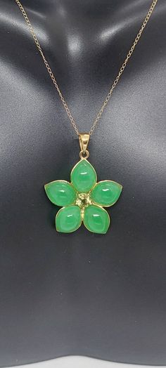 "GREEN Jade/ Peridot Flower 14k Yellow Gold Pendant 18\" Yellow Gold Chain. Jade/Peridot Flower Pendant. Flower Necklace. Flower Petal Jewelry. Petal Necklace. Green Jade Flower LOVER. Product Info: - Pendant Measures: 28x22mm - Stone: Green Jade / Peridot. - Stone Color: Green. - Metal: 14k Yellow Gold - Chain Length: 18 Inches. - Nice Gift Box Included." Green Flower Pendant Jewelry For Wedding, Fine Jewelry With Green Flower Design, Yellow Gold Flower Jewelry For May Birthstone, Green Flower Pendant Necklace For Wedding, Fine Jewelry With Green Flower-shaped Gemstones, Fine Jewelry In Green With Flower Shape, Fine Jewelry In Flower Shape And Green Color, Fine Green Jewelry In Flower Shape, Green Flower Pendant Necklace For Anniversary